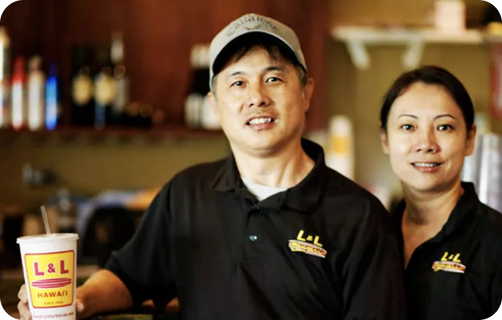 Smiling L&L team members welcoming guests